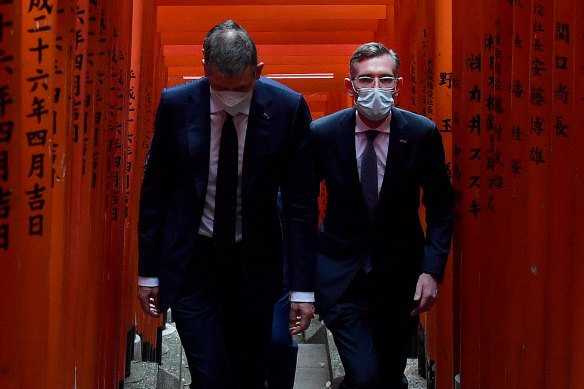 NSW Premier Dominic Perrottet (right) is seen during a visit to the Hie Shrine on his trade mission trip in Tokyo on Thursday.