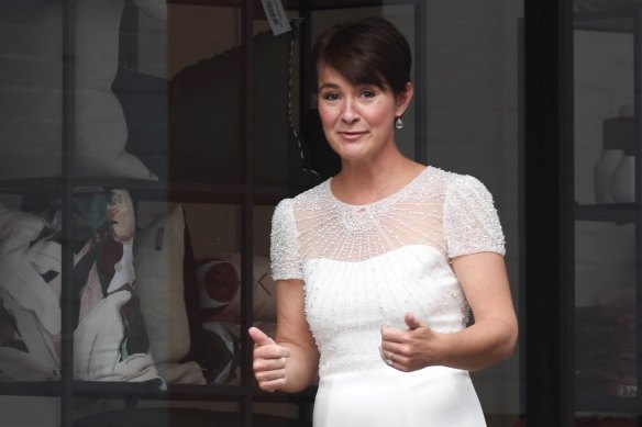 Thumbs up: Miche Paterson arrives at her intimate wedding to media power broker John Hartigan in Paddington on Friday.