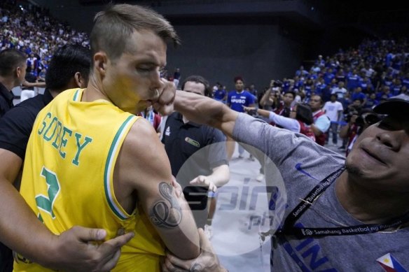 Boomers player Andrew Sobey is punched in the face during the extraordinary brawl.