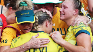 Teagan and Maddison Levi are comforted following the women’s sevens side’s loss in the bronze-medal match.