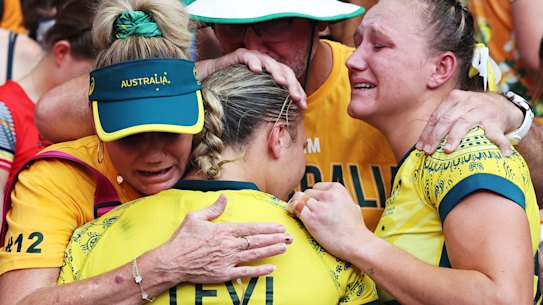 Teagan and Maddison Levi are comforted following the women’s sevens side’s loss in the bronze-medal match.