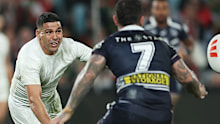 Cody Walker of the Rabbitohs offloads
