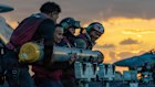 Navy sailors move ordnance on the deck of the USS Gerald Ford aircraft carrier.