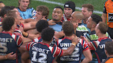 Ronaldo Mulitalo is swarmed by Roosters players.