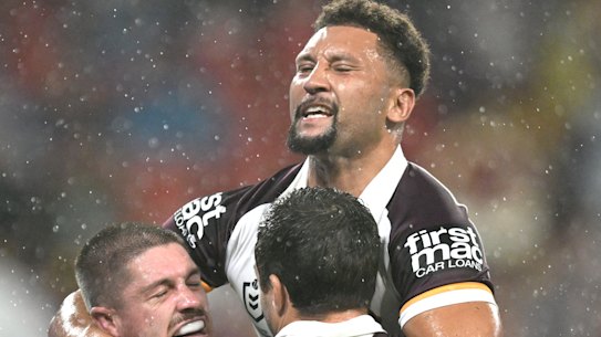 Brisbane Broncos celebrate against the Dolphins.