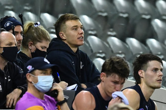 David Teague’s manager has criticised Blues captain Patrick Cripps, pictured on the sidelines during round 23, after Carlton delayed a call on the coach’s future. 
