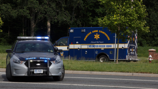 An ambulance turns on Nimmo Parkway following a shooting at the Virginia Beach Municipal Centre on Friday.