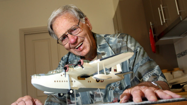 Dudley Marrows with a model of a Sunderland flying boat, similar to the aircraft he captained during World War II. 