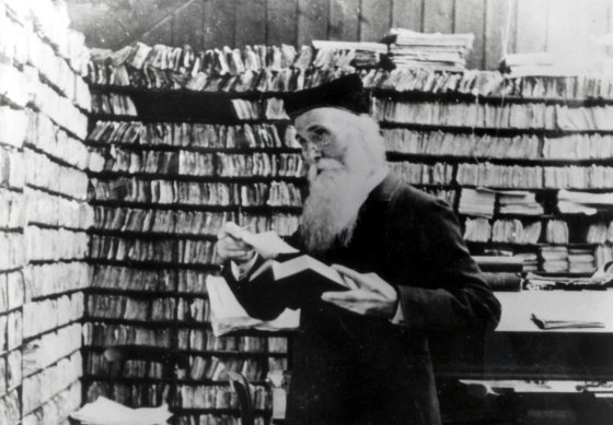Sir James Murray, first editor of the Oxford English Dictionary, surrounded by files of word definitions.