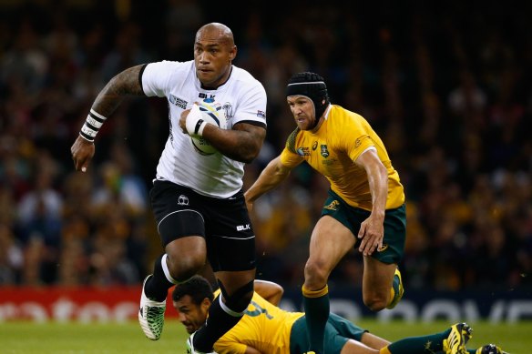 Nemani Nadolo goes past Matt Giteau at the 2015 World Cup.