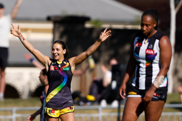 Monique Conti celebrates a late goal as Sabrina Frederick looks dejected.
