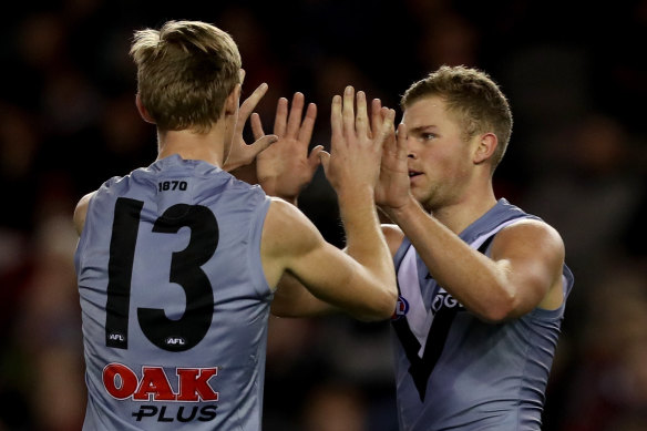 Dan Houston of the Power celebrates a goal during their defeat of Essendon.