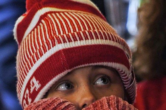 A disappointed young Sydney Swans supporter at Rising Sun Hotel in South Melbourne. 