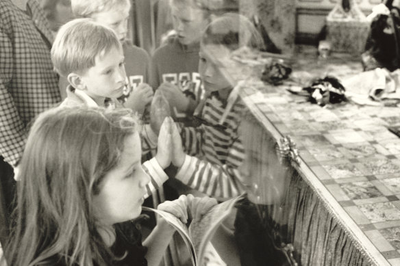 Children enthralled by the Myer Christmas windows on December 20, 1991