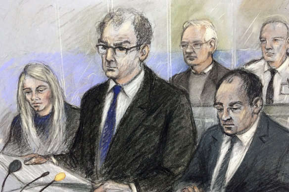 A sketch of Julian Assange, back and second from right, in court on Monday.