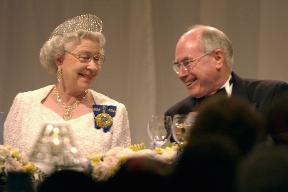 Queen Elizabeth II with prime minister John Howard at a dinner at the Festival Centre February 27, 2002 in Adelaide.