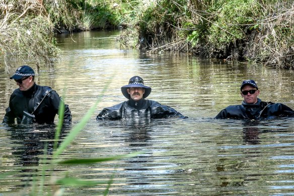 Police searching an area of bushland and Darebin Creek west of Sheehan Road.