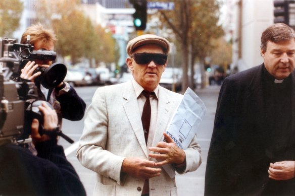 Gerald Ridsdale outside court in 1993, accompanied by George Pell.