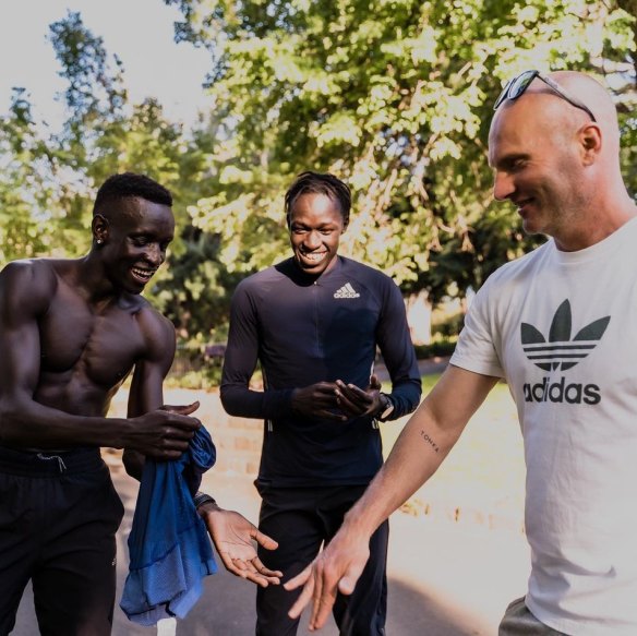 “Athletics is a pretty humble sport,” says Peter Bol (left) with fellow 800 metres star Joseph Deng and coach Justin Rinaldi.