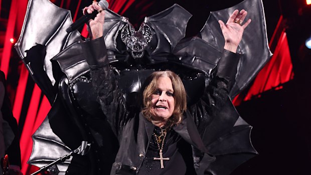Ozzy Osbourne performing on his bat-winged throne during his induction into the Rock & Roll Hall of Fame in Cleveland, Ohio, in 2024.