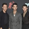Kevin Jonas, Joe Jonas and Nick Jonas of the Jonas Brothers arrive at the MTV Video Music Awards at the Prudential Center.