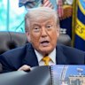 Trump displays a rendering of the UFC Freedom 250 event.