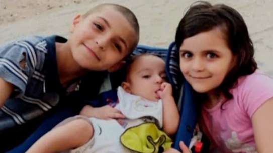 Adam Najjar (left), who survived the strike, with sisters Sidra and Eve, two of the children killed.