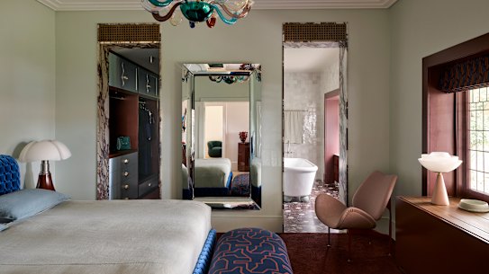 Interior designer Greg Natale used burgundy liberally in this project in Sydney, including tiles, carpet and joinery.
