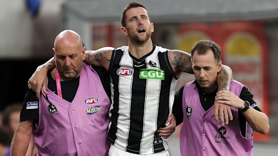 Jeremy Howe is helped from the field on Friday.