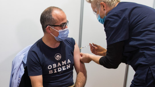 James Merlino being vaccinated on Friday.