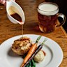 Braised steak and Guinness pie with mash and roasted vegetables.