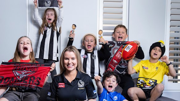 Casey Nunn shares the couch with young footy fans. (L-R) Charlotte 7, Chloe 6, Molly 6, Andre 4, Lachlan 9, and Levi 8.