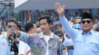 Presidential candidate Prabowo Subianto, centre right, and his running mate Gibran Rakabuming Raka, the eldest son of Indonesian President Joko Widodo, greet their supporters during their campaign rally at Gelora Bung Karno Main Stadium in Jakarta on Saturday,