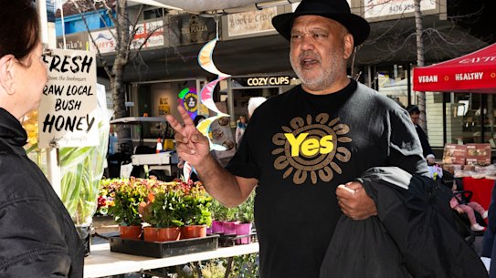 Indigenous leader Noel Pearson with federal MP Julian Leeser (centre) and state MP Matt Kean speaking to Christa from the honey stall.