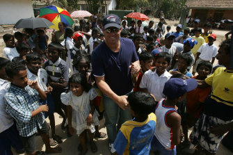 Warne joins forces with Muralitharan at a Tsunami refugee camp in Galle, Sri Lanka
