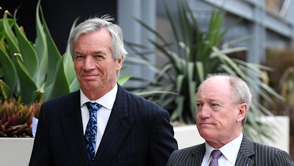 Bruce Hodgkinson SC (right) and James Bell QC, lawyers for Ardent Leisure, arrive for the inquest into the Dreamworld disaster at the Magistrates Court at Southport in June.
