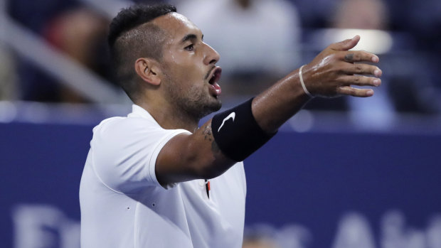 Nick Kyrgios points out distractions in the crowd during his match against Steve Johnson.