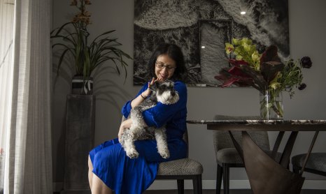 Jo Cooper and her pet schnauzer Angus in her Darlinghurst apartment. 