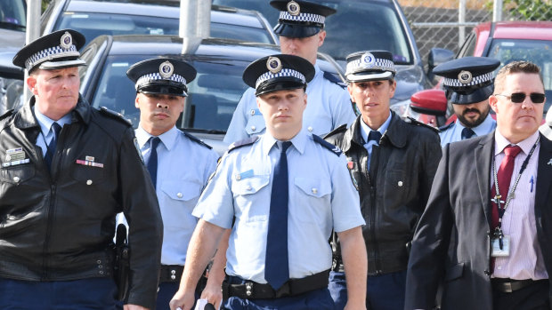 Senior Constables Frederick Tse, second from left, and Jakob Harrison, centre, arrive at the Coroners Court in Sydney with fellow NSW Police officers on Monday.