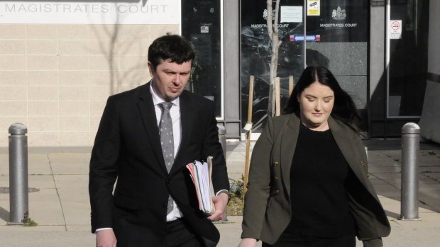 Convicted fraudster Taylor Jade Geoghegan leaves the ACT Magistrates Court with her lawyer, Michael Kukulies-Smith.
