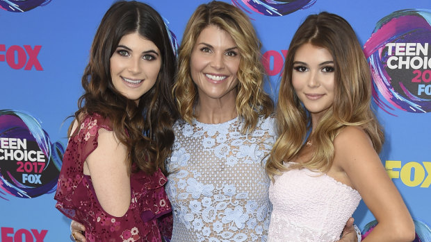 Actress Lori Loughlin, centre, poses with her daughters Bella, left, and Olivia Jade at the Teen Choice Awards in Los Angeles.