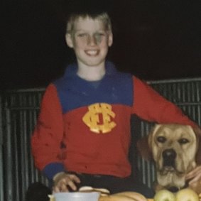 The author and his mate Chip playing on a haystack in the mid-1990s.