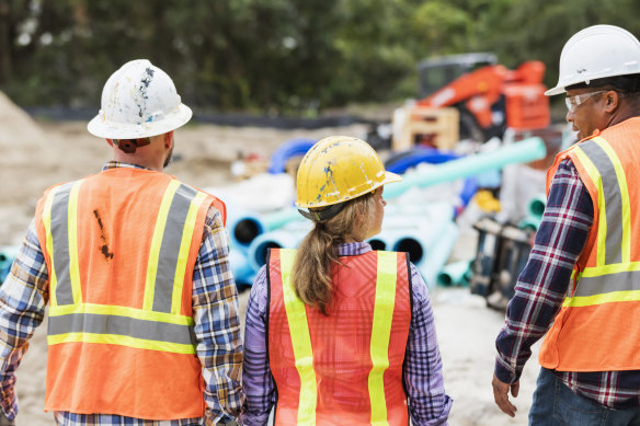 Government projects are guzzling workers needed for housing, the property industry lobby says. 