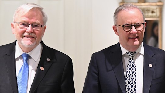 The Prime Minister and Australia’s US ambassador Kevin Rudd arrive for a breakfast meeting in Washington on Tuesday.