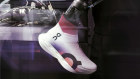 A photo provided by the Swiss sneaker brand On shows an upper for the one-piece Cloudboom Strike LS as it is created in a single step using an automated robotic arm at the On labs in Zurich. On and Hellen Obiri are taking the running-shoe game to a whole new level.