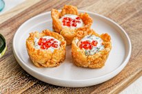 Crushed potato gem cups are a perfect vessel for caviar and creme fraiche.