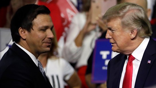Ron DeSantis and Donald Trump shakes hands at a rally in 2018. DeSantis is now a potential Trump rival for the White House.