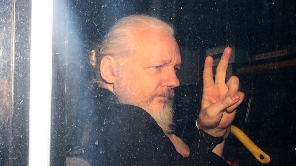 Assange in a police vehicle following his arrest at London’s Ecuadorian embassy in April. 