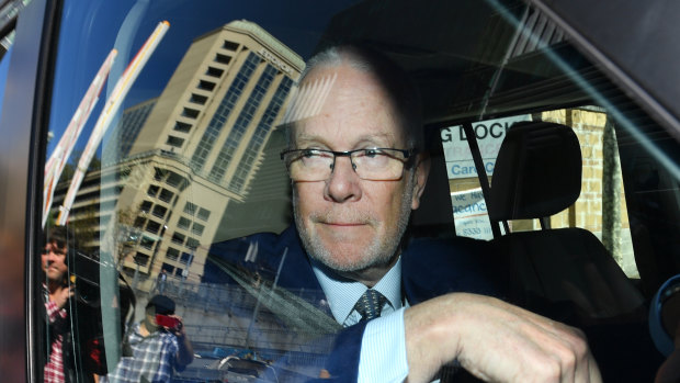 Justin Milne leaves the ABC studios after resigning his chairmanship.