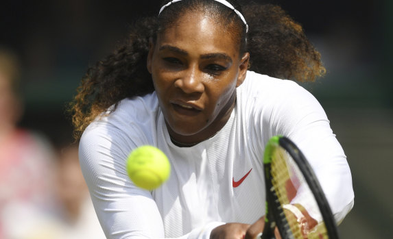 Serena Williams returns serve on her way to defeating Julia Goerges in the  women's semi-final at Wimbledon on Thursday.